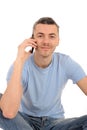 Casual young man with cell phone Royalty Free Stock Photo