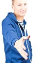 Casual young man giving a handshake Royalty Free Stock Photo