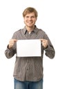 Casual young man holding blank sheet Royalty Free Stock Photo