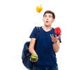 Casual young man juggles with pepper Royalty Free Stock Photo
