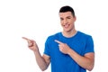 Casual young man pointing away Royalty Free Stock Photo