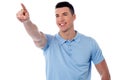 Casual young man pointing away Royalty Free Stock Photo