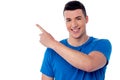 Casual young man pointing away Royalty Free Stock Photo
