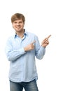 Casual young man pointing to blank space Royalty Free Stock Photo