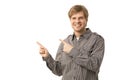 Casual young man pointing to blank space Royalty Free Stock Photo