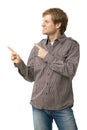 Casual young man pointing to blank space Royalty Free Stock Photo