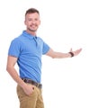 Casual young man presents something Royalty Free Stock Photo