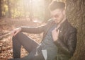 Casual young man sitting in the park Royalty Free Stock Photo