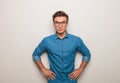Casual young man standing with hands on waist Royalty Free Stock Photo