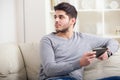 Casual young man using a tablet at home Royalty Free Stock Photo