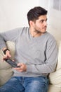 Casual young man using a tablet at home Royalty Free Stock Photo