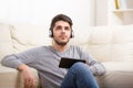 Casual young man using a tablet at home Royalty Free Stock Photo