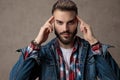 Casual young model wearing blue denim jacket Royalty Free Stock Photo