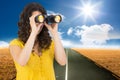 Casual young woman using binoculars Royalty Free Stock Photo