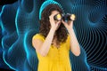 Casual young woman using binoculars Royalty Free Stock Photo