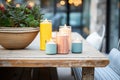 casually arranged patio candles on rustic table Royalty Free Stock Photo