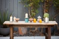 casually arranged patio candles on rustic table Royalty Free Stock Photo