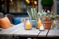 casually arranged patio candles on rustic table Royalty Free Stock Photo