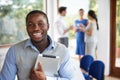 Casually Dressed Businessman Attending Meeting In Boardroom Royalty Free Stock Photo