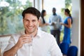 Casually Dressed Businessman At Meeting In Boardroom