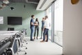 Casually Dressed Businessmen And Businesswomen Having Informal Meeting In Modern Boardroom Royalty Free Stock Photo