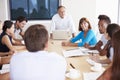 Casually Dressed Businesspeople Having Meeting In Boardroom Royalty Free Stock Photo