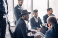 Casually dressed male colleagues at a meeting, close up Royalty Free Stock Photo