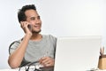 Startup business man smiling while talking on the phone and having fun at work Royalty Free Stock Photo