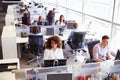 Casually dressed workers in a busy open plan office Royalty Free Stock Photo