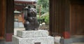 Cat, animal and statue of manekineko in Japan for luck, success and gratitude outdoor at Gotokuji temple. Sculpture