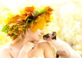 Cat and autumn nymph Royalty Free Stock Photo