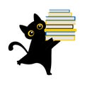Black cute cat holds a lot of books in its paws. Education and reading concept. Royalty Free Stock Photo