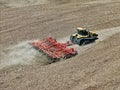 CAT Challenger MT875C tractor pulling a .KUHN Krause Excelerator 8005 disc cultivator for spring planting