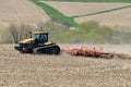 CAT Challenger MT875C tractor pulling a .KUHN Krause Excelerator 8005 disc cultivator for spring planting Royalty Free Stock Photo