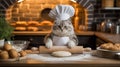 Cat chef with rolling pin preparing dough in a kitchen. Royalty Free Stock Photo