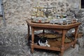 The cat chilling out under the table  with the oriental fashioned silverwork,copperwork items Royalty Free Stock Photo