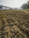 CAT digger moving soil into back of large truck at the new developing construction site Royalty Free Stock Photo