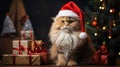 The cat is dressed like Santa Claus and wears red Santa hats The Christmas tree and gifts can be seen in the background Royalty Free Stock Photo