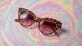 Brown Leopard Print Cat Eye Sunglasses on Pastel Swirl Background image Royalty Free Stock Photo