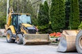 CAT 420F2 Backhoe Loader in residential neighbourhood