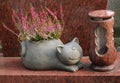 Cat flowerpot with heather