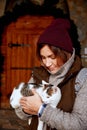 Cat in the hands of girl volunteer, in shelter for homeless animals. Pets Royalty Free Stock Photo