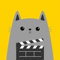 Cat holding movie clapper board. Cute cartoon funny character. Cinema theater. Kitten watching movie. Film show. Kids sticker