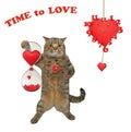 Cat holds hourglass with hearts Royalty Free Stock Photo