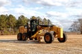 Cat industrial front loader shovel on a vacant lot