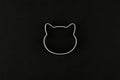 Cat logo on a black background. Cat head logo. Abstract logo with a cat`s head in black and white. Metolic cat