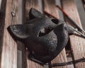 A cat mask on a bench.