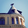 The Cat sculpture on the rooftop. Cat House in Riga, Latvia - vintage filter. Royalty Free Stock Photo