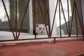 Cat sitting on the window behind bars Royalty Free Stock Photo