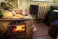 Cat sleeping on stove fireplace Royalty Free Stock Photo